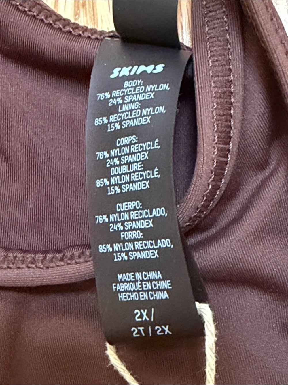 New! Skims 2X recycled high neck racer back swim top in cocoa .
